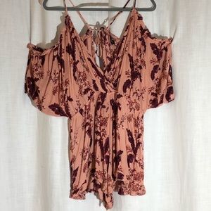 Topshop romper in pink with floral prints.